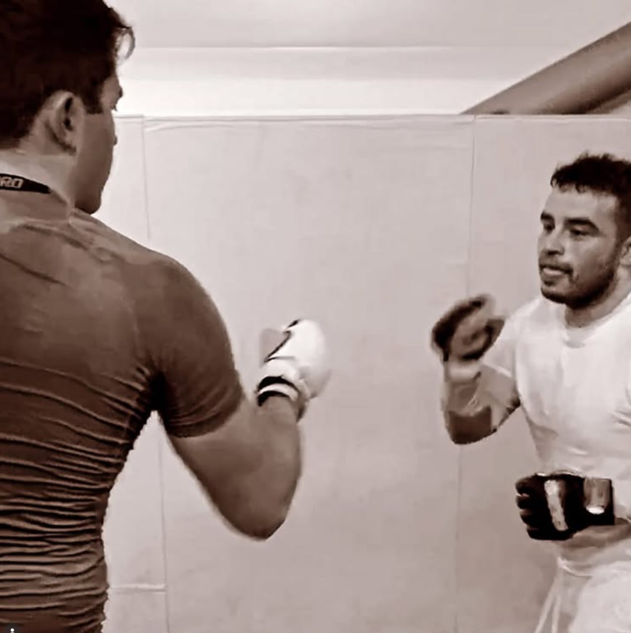 Ed coaching striking technique during a kickboxing session